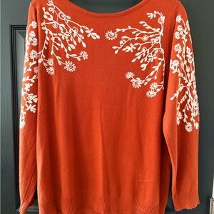 Women's Orange Sweater with White Floral Design
